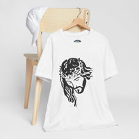 White t-shirt with minimalist black graphic of Jesus wearing a crown of thorns, hanging on wooden hanger.